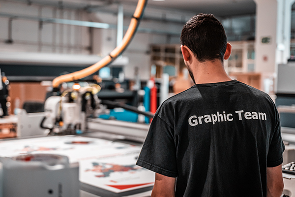 alphabet signs employee at printing machine