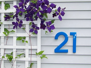 plastic numbers 21 on side of building