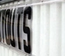 side view of portable sign letters pinched between sign track