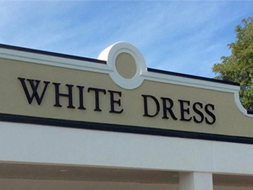 storefront sign letters that say white dress