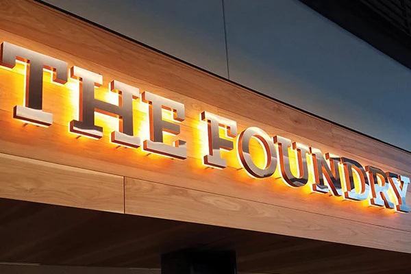 illuminated logo for indoor lobby counter